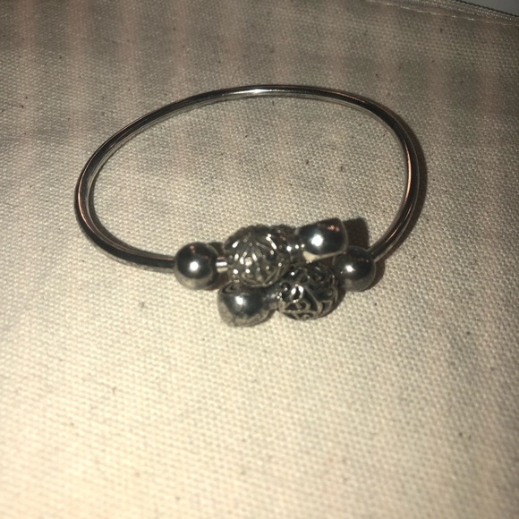 Silver Camilla flex bangle and two beads. - Picture 2 of 3